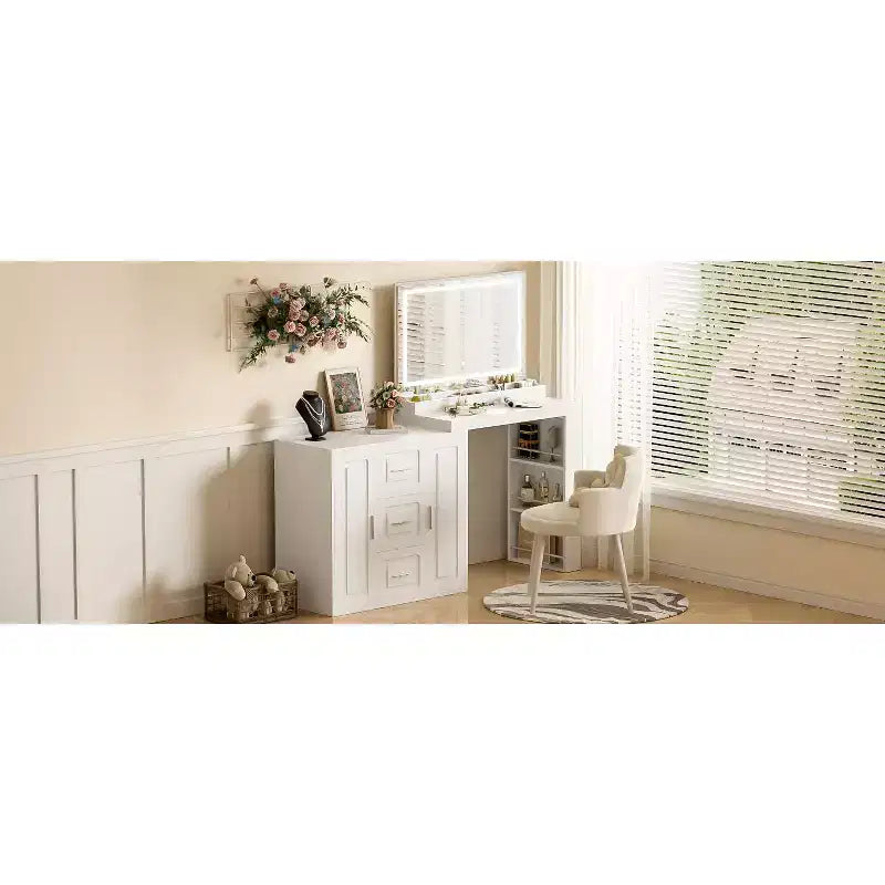 The dressing table includes a mirror with a light, 3 drawers, 2 cabinets, and storage shelves. A stool is not included White